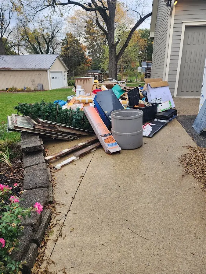 Dumpster being loaded with debris for 10 Yard Dumpster Rental in Ontario
